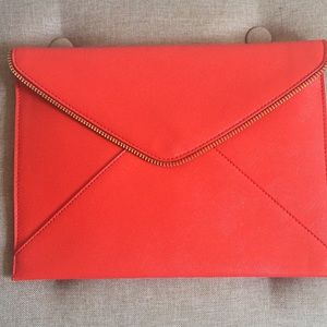 Red saffiano envelope clutch bag.